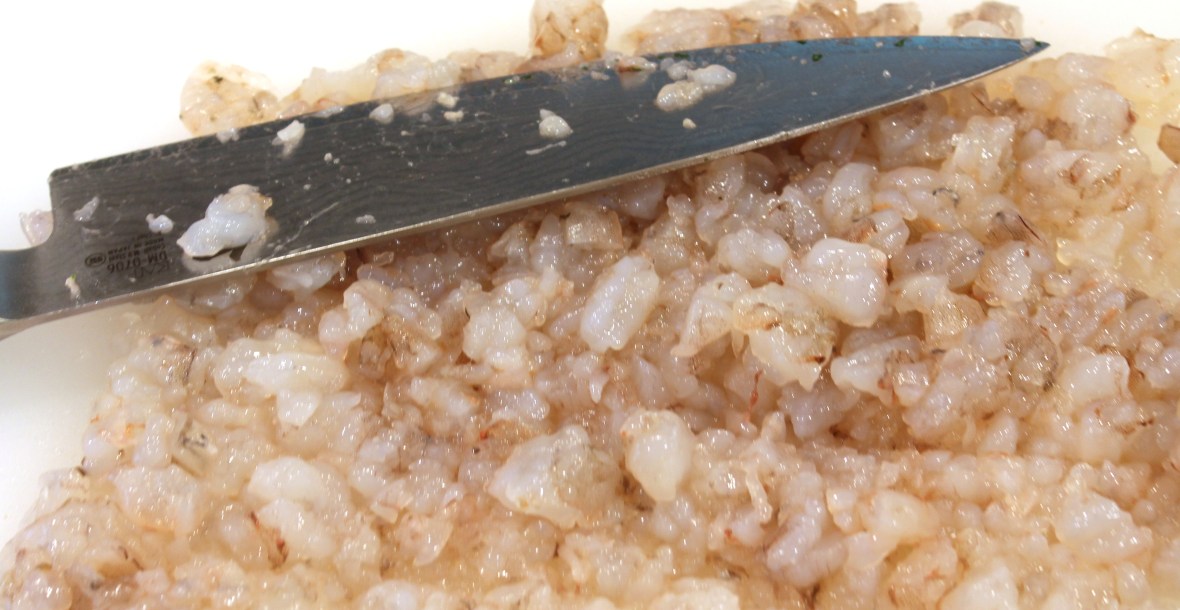 Chopping uncooked shrimp