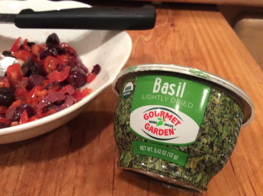 A handy-size container of freeze dried basil so I have it when I need it.
